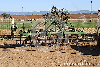 Old tractor rake in a meadow Editorial Stock Photo