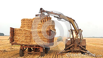 Old tractors with a trailer for harvesting. Editorial Stock Photo