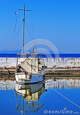 Boat reflection on a small pond at Palaio Faliro Attica Greece Stock Photo