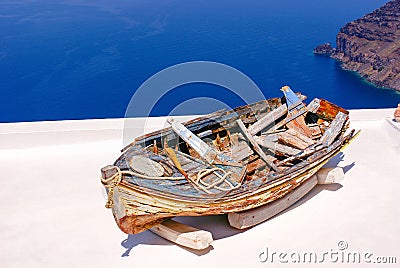 Old traditional boat on terrace, Santorini island Stock Photo