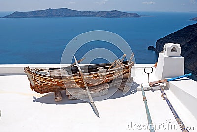 Old traditional boat on terrace, Santorini island Stock Photo