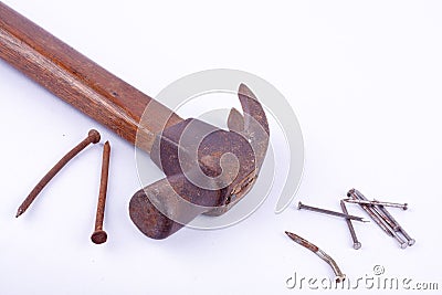 old Traditional curved claw hammer and rust nail tack used on white background tool isolated Stock Photo