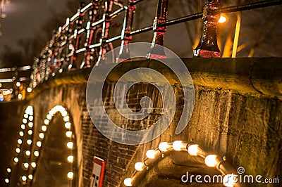 Old traditional Dutch bridge in the city channel close-up Stock Photo