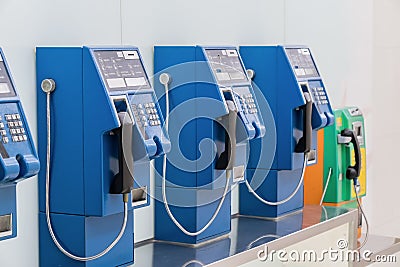 Old and traditional public telephones using the coins Editorial Stock Photo