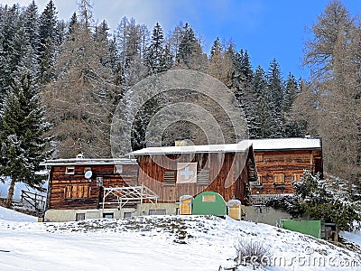 Old traditional swiss rural architecture and alpine livestock farms in the winter ambience of the tourist resort of Lenzerheide Editorial Stock Photo