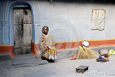 Old tribal Woman Sat in front of her mud house. Environmental Portrait of old tribal lady. Editorial Stock Photo