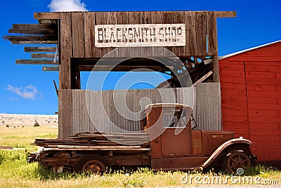 Old Truck and Blacksmith Shop Stock Photo