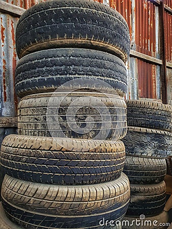 Old truck tires can be recycled, used to make shoes, bags, furniture, or use as plant pots. Stock Photo