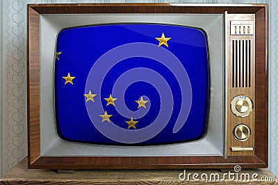 Old tube vintage TV with the national flag of the USA, the state of Alaska on the screen, the concept of eternal values, global Stock Photo