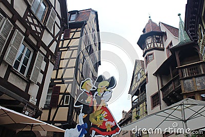 Old tudor style houses with oriels and towers in Colmar Editorial Stock Photo