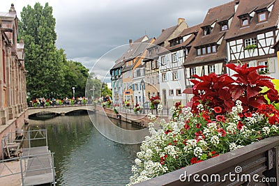 Old tudor style houses at the river in Colmar Stock Photo