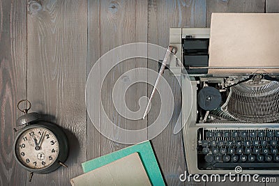 Old typewriter and alarm clock Stock Photo