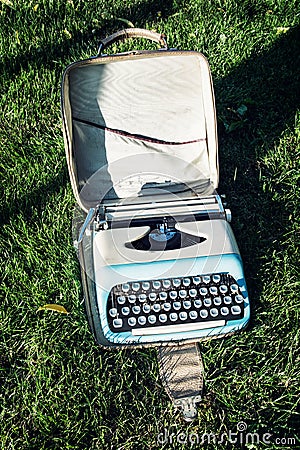 Old typewriter on the grass Stock Photo