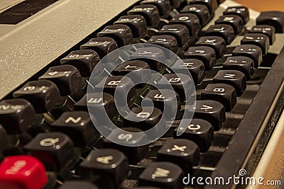 An old typewriter, with its keys and arms with the letters of the alphabet drawn above. Stock Photo