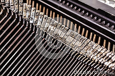 Old typewriter letters on type bar Stock Photo