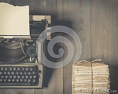 Old typewriter and a stack of old letters Stock Photo