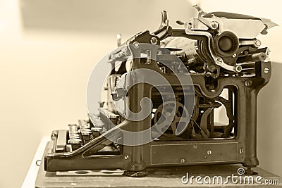 Old typewriter stands on the table in antique photography vintage simulated. Stock Photo
