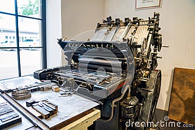 Old typography printing machine with letter samples. Editorial Stock Photo