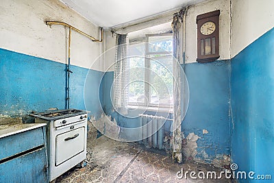 Old ugly abandoned empty kitchen in a residential building Stock Photo