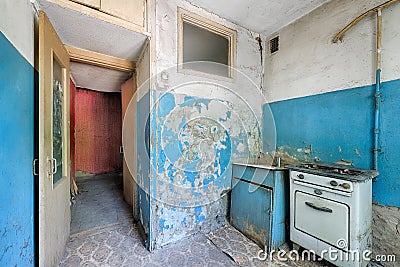 Old ugly abandoned empty kitchen in a residential building Stock Photo