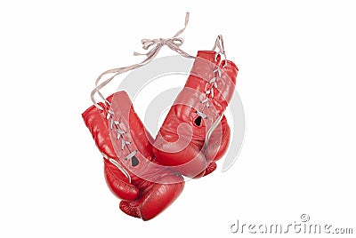 Old used and battered red leather boxing gloves with laces isolated on white background Stock Photo