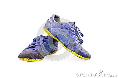 Old used blue worn out futsal sports shoes on white background soccer sportware object isolated Stock Photo