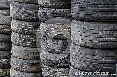 Old used car tires stacked in stacks Stock Photo