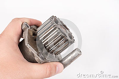 Old used dirty car water pump in the hand above white background Stock Photo