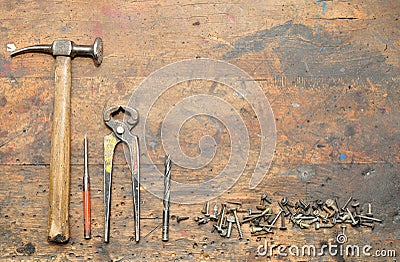 Old used dirty workbench with tools. Stock Photo