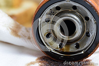 Old used motor oil filter close up shot. Stock Photo