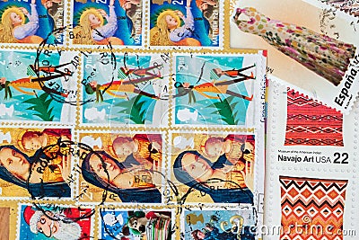 Old used postage printed stamps from various countries as background. For pattern, wallpaper, banner design Editorial Stock Photo
