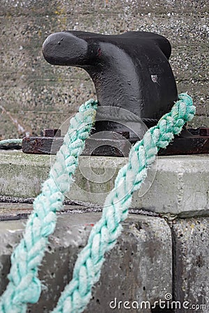 An old, used rope somewhere at the harbor Stock Photo