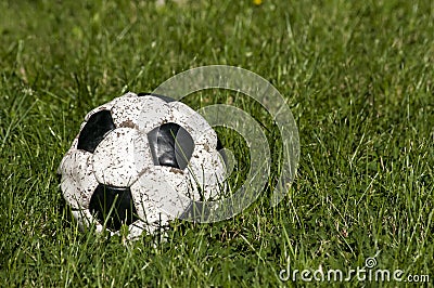 Old used shabby leather soccer ball Stock Photo