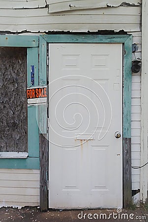 Old Vacant Storefront and For Sale Sign Stock Photo