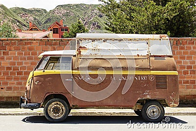 Old van against brick wall Editorial Stock Photo