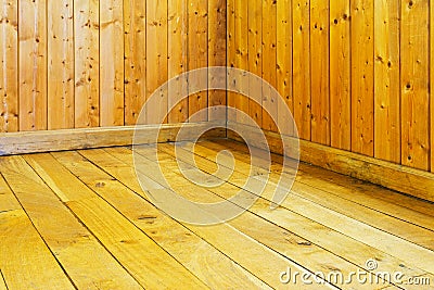 Old varnished wooden floor and wall of room Stock Photo