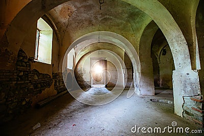 Old vaulted basement under abandoned castle Stock Photo
