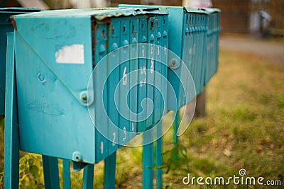 Old vertical metal mailboxes in the street Stock Photo