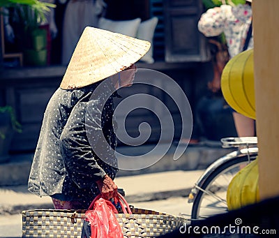 Old Vietnamese woman in Hoi An Editorial Stock Photo