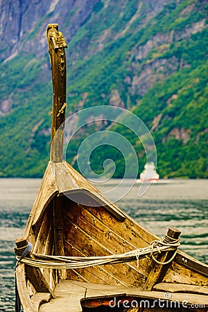 Old viking boat and ferryboat on fjord, Norway Stock Photo