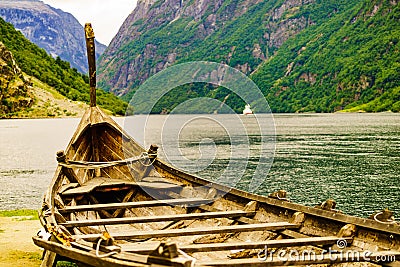 Old viking boat and ferryboat on fjord, Norway Stock Photo