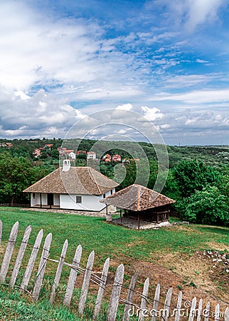 Old vilage house and cloudy sky. Stock Photo
