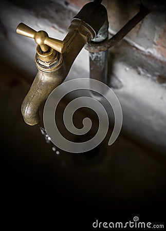 Old vintage brass water faucet Stock Photo