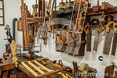 An old vintage carpenter`s wood workshop with lot of tools Stock Photo