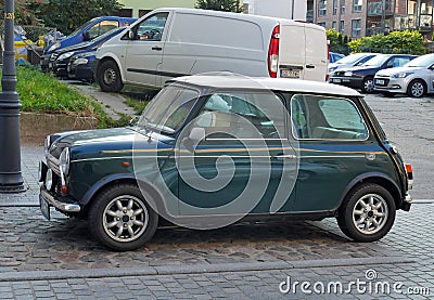 Old vintage classic dark green Morris Mini Cooper parked Editorial Stock Photo