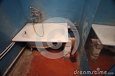 Old vintage dirty broken bathroom. Trash repairs. Grunge background Stock Photo