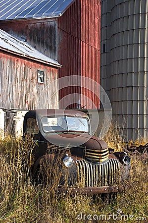 Old Vintage Farm Truck by Barn Stock Photo