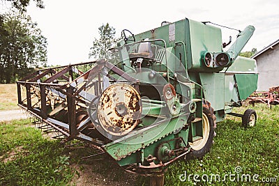 Old vintage farming agricultural harvester Stock Photo