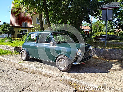 Old vintage green Morris Mini Cooper parked Editorial Stock Photo