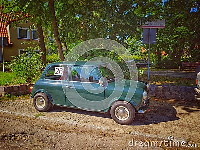 Old vintage green Morris Mini Cooper parked Editorial Stock Photo